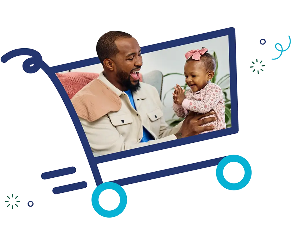 Father holding baby in shopping cart frame