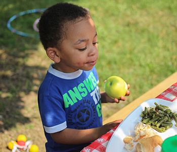 boy eating an apple