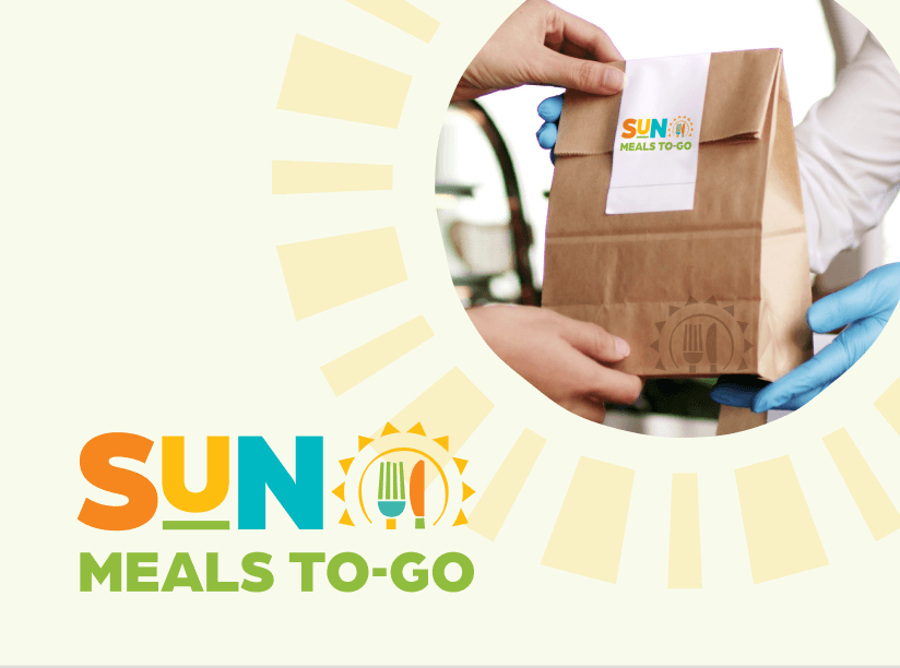 SUN Meals To-Go logo on a light yellow background with an image of a brown lunch sack being handed off in the upper right hand corner