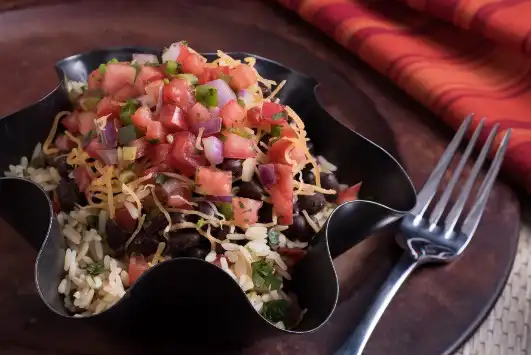 burrito bowl with a fork on the side