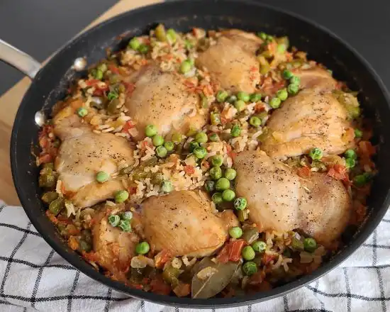 chicken and rice in a cast iron skillet