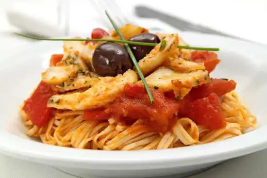 plate of codfish on spaghetti