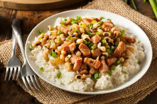 dish of white rice with beans and ham on top