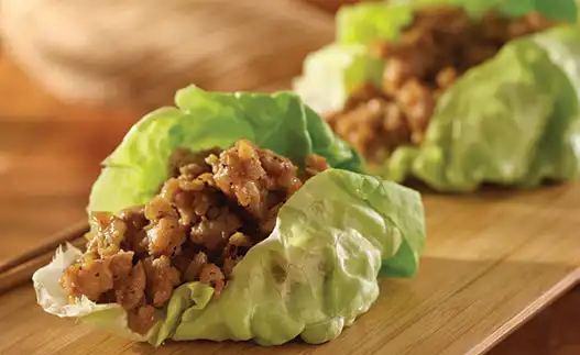 two lettuce wraps with filling