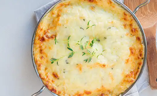 a pan of potato spinach casserole