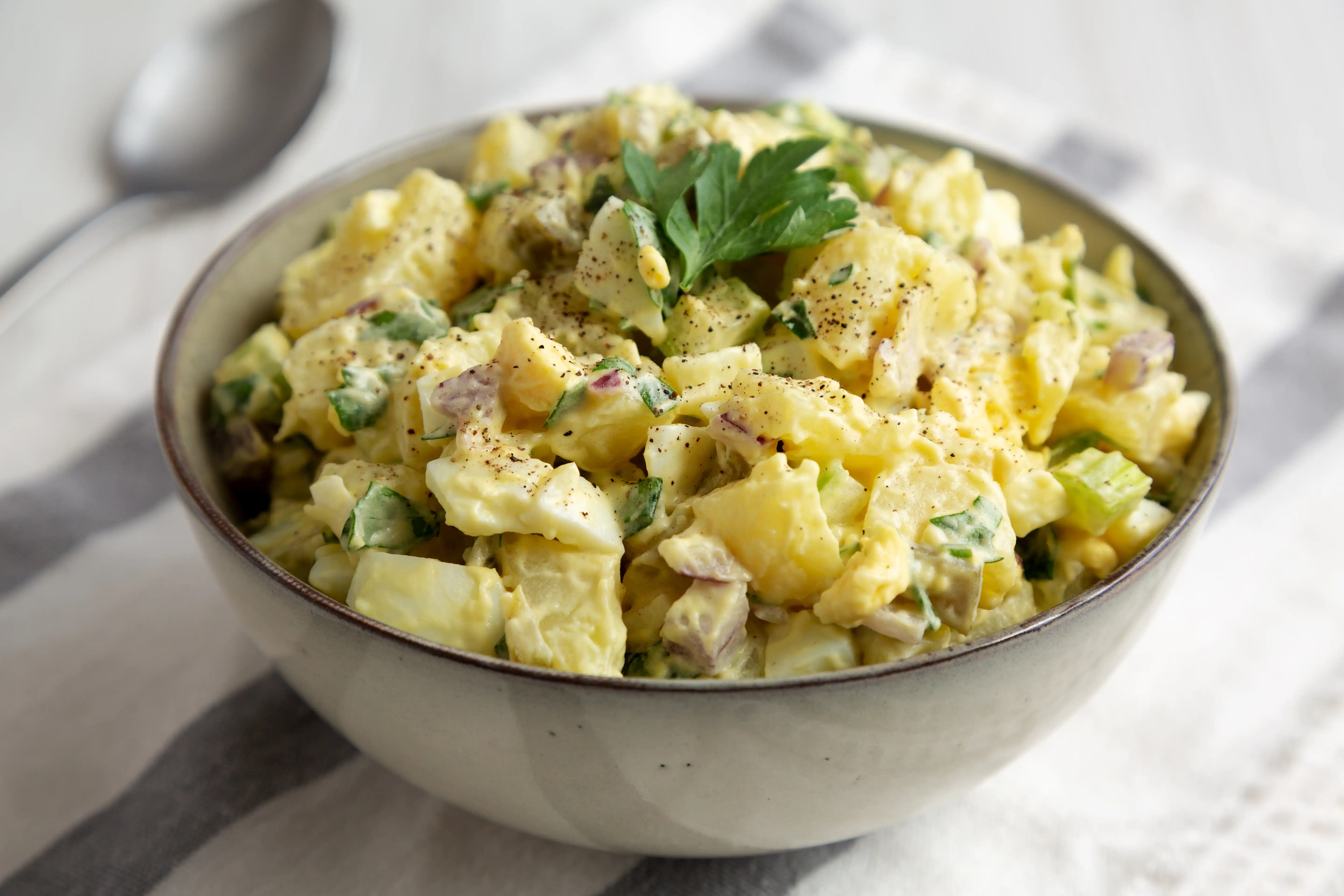 a bowl of red potato salad