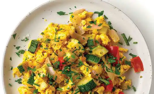 plate with scrambled eggs and zucchini