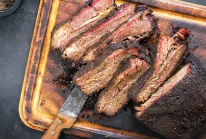 cutting board with chopped bbq