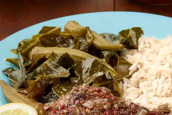 plate with a side of spicy okra and greens