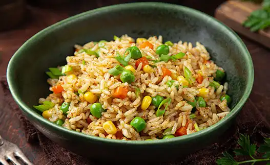 large black bowl of fried rice with vegetables