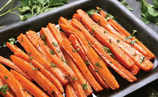 sheet pan with cooked carrots