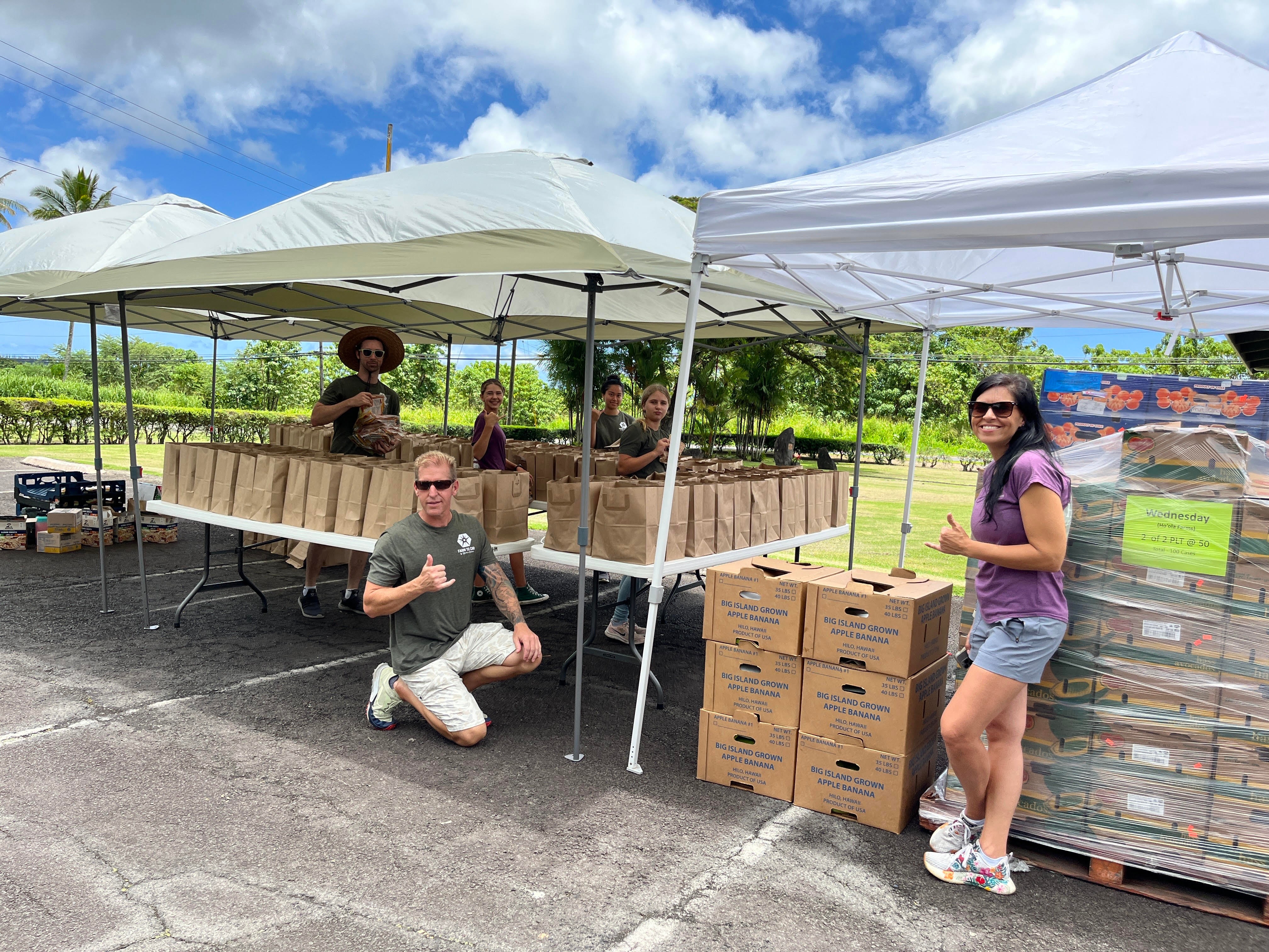 The Hoʻōla Farms team sets up for distribution at Puna Hongwanji.