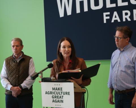 Secretary Rollins at a podium with a sign "Make Agriculture Great Again"
