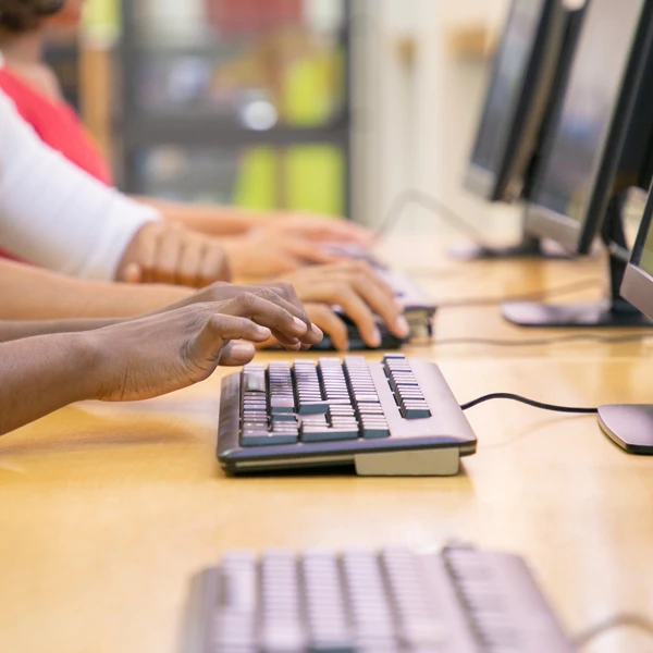 hands typing on a keyboard