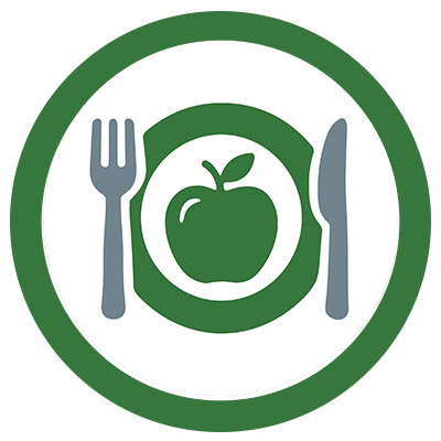 apple on a plate with utensils