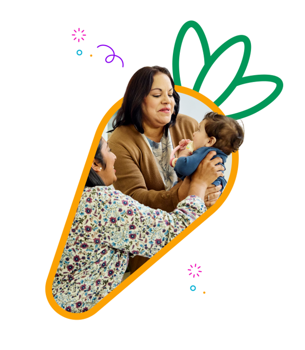 two women holding a baby embedded in an illustrated carrot