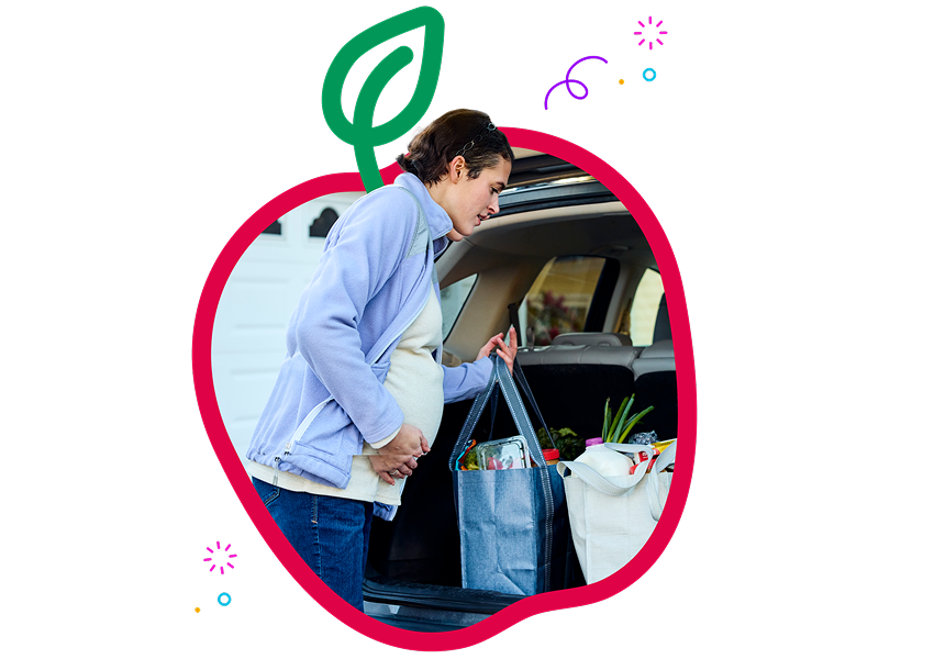 a pregnant woman reaching for groceries embedded in a graphic apple