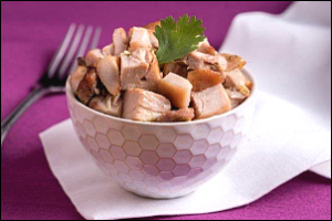 Bowl with cubes of baked chicken