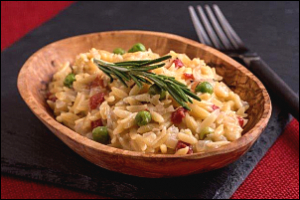 bowl of orzo pasta with green peas