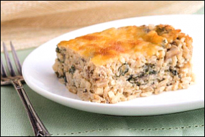 Square of rice vegetable casserole on a plate