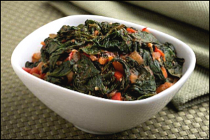 dish of sauteed spinach with tomatoes