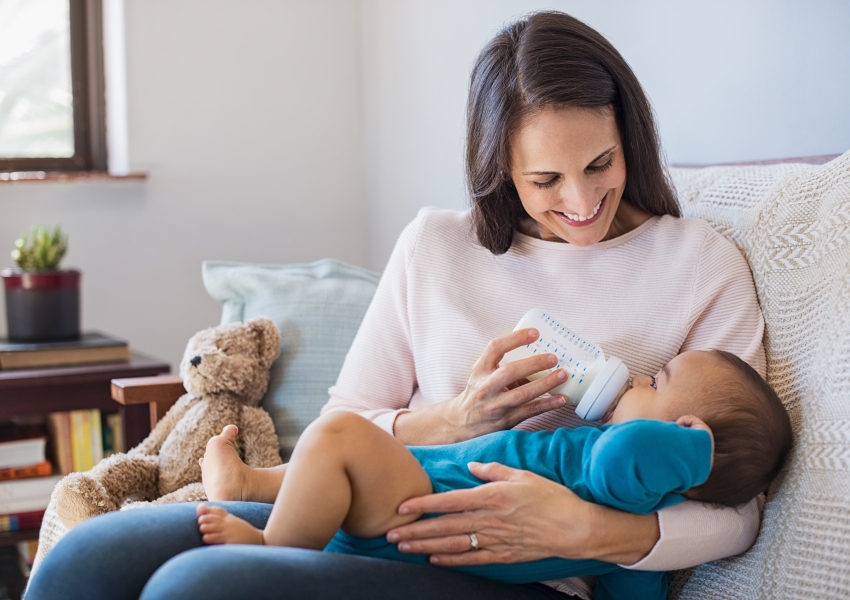woman bottle feeding