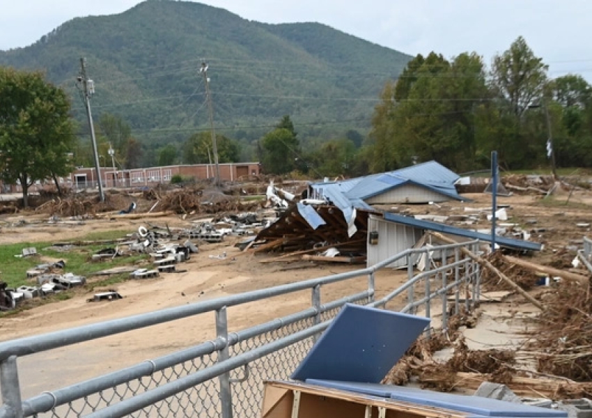 destroyed buildings in front of a NC mountain