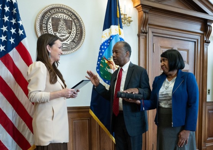 Dr. Carson being sworn in by Secretary Rollins