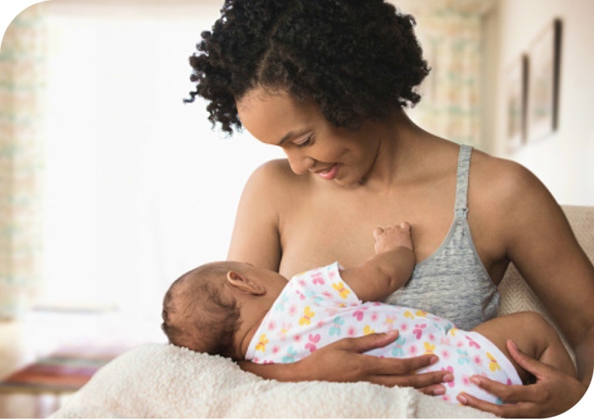 woman breastfeeding her infant