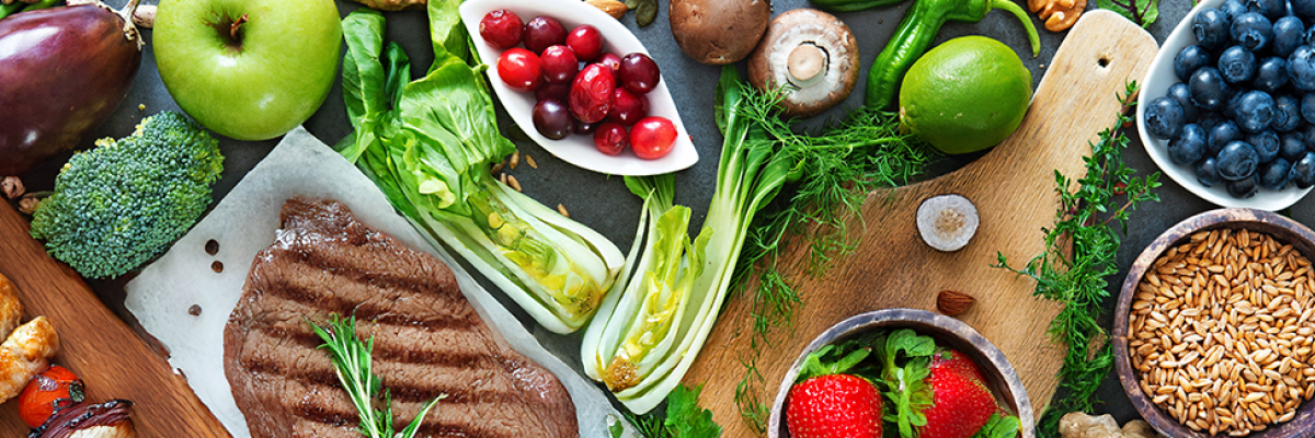 array of healthy foods on a gray background