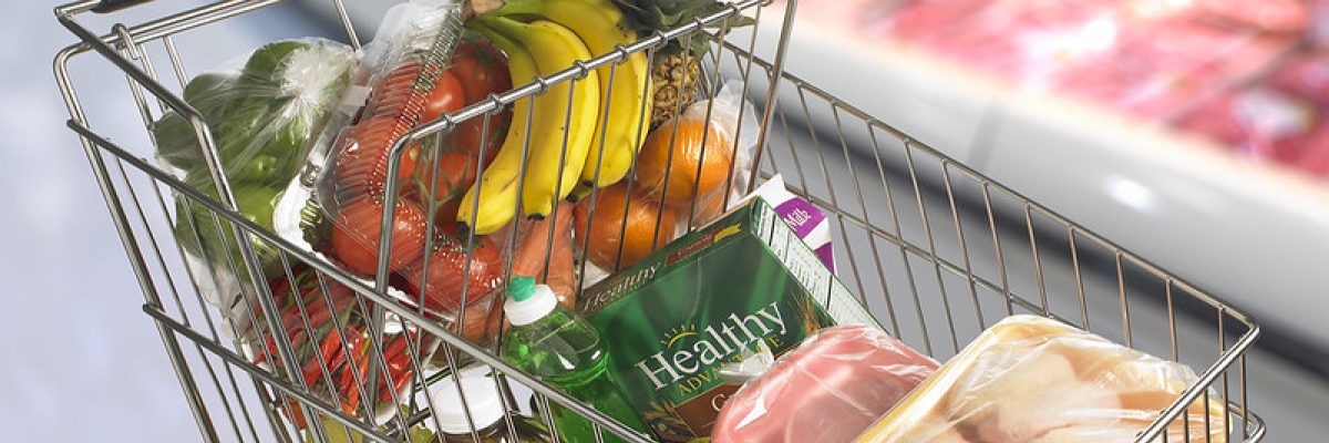 a grocery cart full of healthy food items