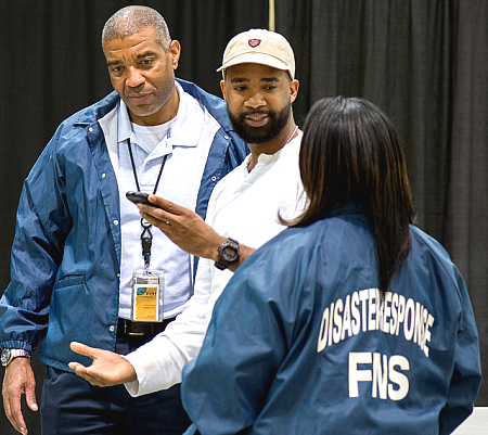 group of disaster responders talking