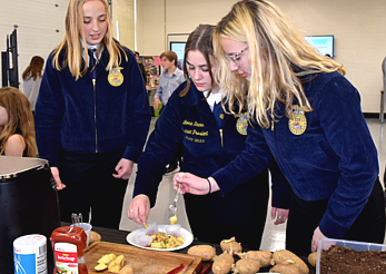 Girls from Future Farmers of America demonstrating a taste test